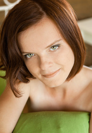 18 year old beauty Agnes takes great care in flaunting perky tits in the nude